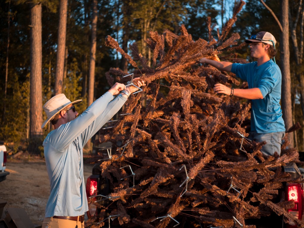 AES crew installing fish habitat equipment.
