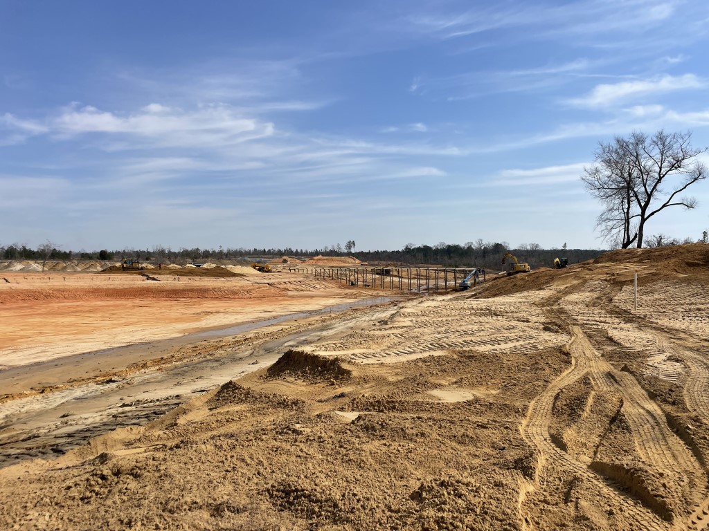 Construction of cart path over lake bed