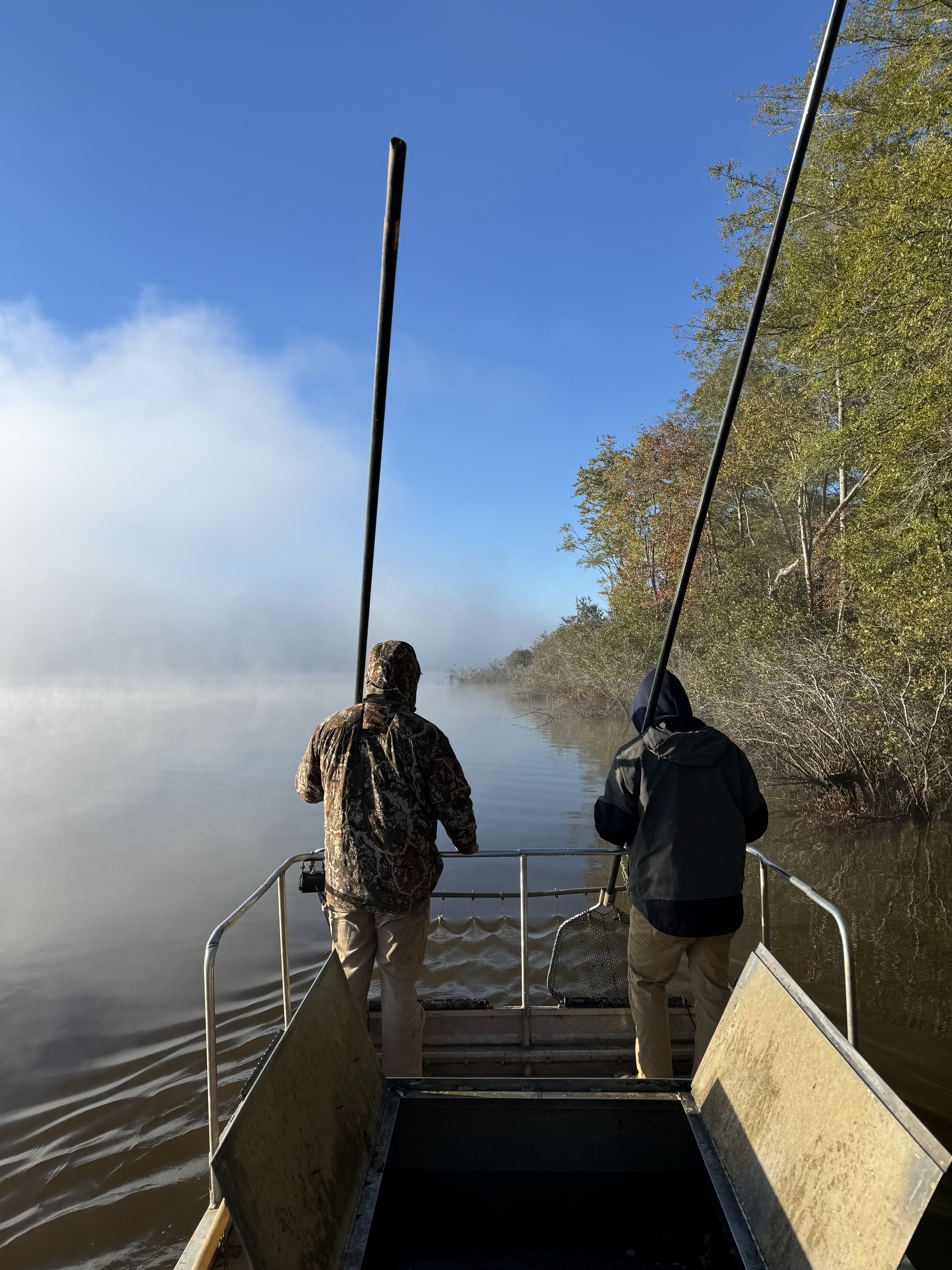 2 AES working electrofishing a lake