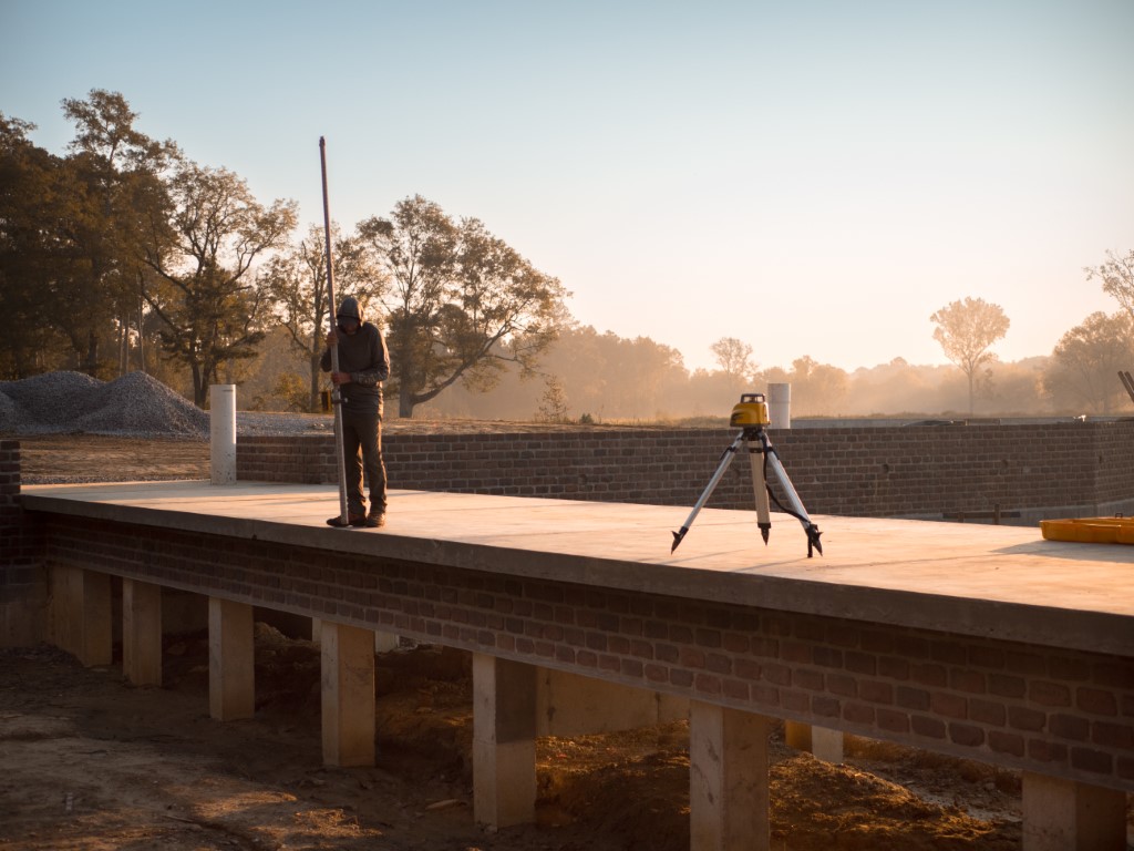 AES worker surveying land
